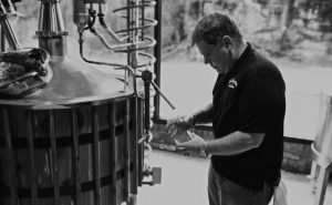 Colin Futz inspects equipment at Kentucky Mist Distillery.