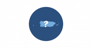 A blue map of Puerto Rico on a navy circle and behind a white question mark