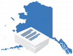 A large blue map of Alaska positioned behind a stack of white business documents.