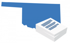 A large blue map of Oklahoma positioned behind a stack of white business documents.